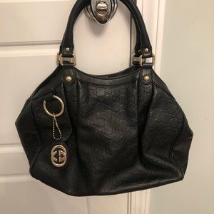 Gucci medium size black leather handbag